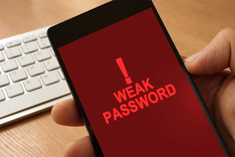 Phone with weak password warning on screen